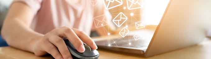 Email marketing concept. Hand using computer sending message with envelope icon