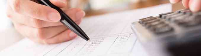 Close-up of accountant working on report