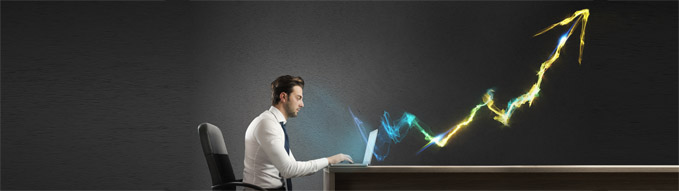 Businessman working at computer with light arrow