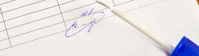 A corrector brush and a colored false signature on a piece of paper
