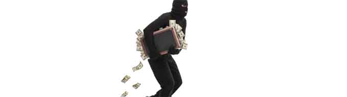 Studio shot of a male burglar with a mask on his head running with a briefcase full of money isolated on white background
