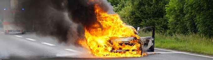 A car is ablaze on the highway