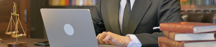 Denying Middle Aged Lawyer Working on Laptop