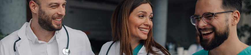Medical professionals sharing a lighthearted moment, enjoying camaraderie and positive atmosphere