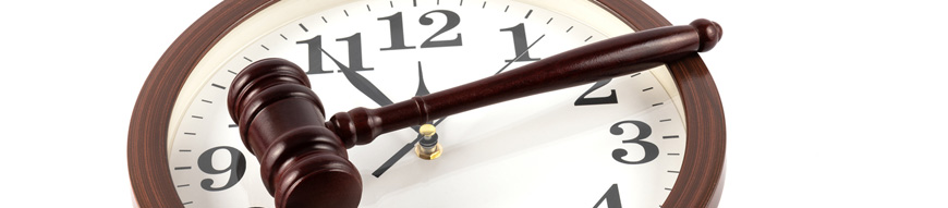 Ordinary wall clock and judge's gavel
